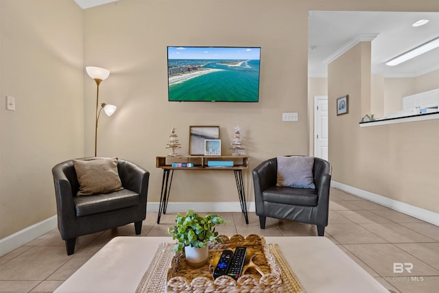 sitting room with light tile patterned floors and crown molding