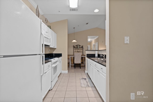 kitchen featuring white appliances, sink, light tile patterned floors, white cabinets, and lofted ceiling