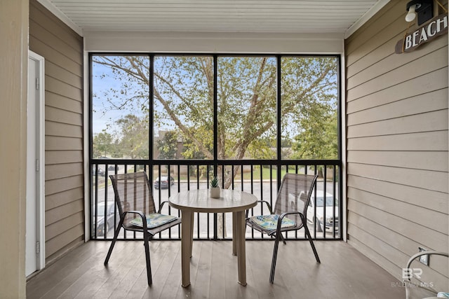 unfurnished sunroom featuring a wealth of natural light