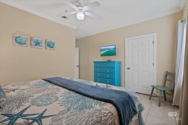 bedroom featuring ceiling fan, ornamental molding, and light tile patterned floors