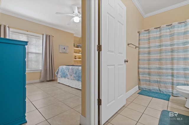 bathroom with tile patterned flooring, ceiling fan, a shower with shower curtain, toilet, and ornamental molding