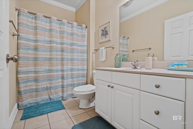 bathroom with toilet, vanity, tile patterned floors, and ornamental molding