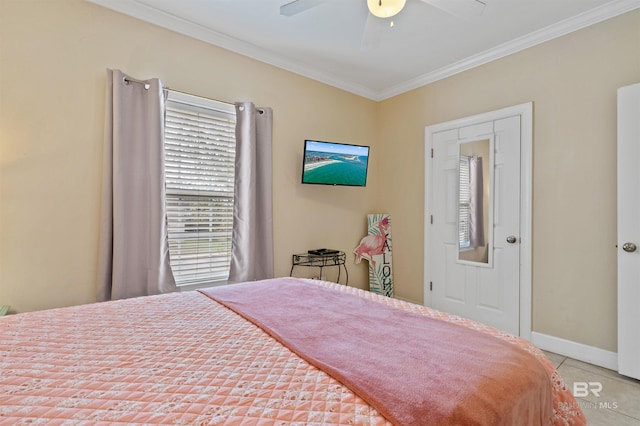 tiled bedroom with ceiling fan and crown molding