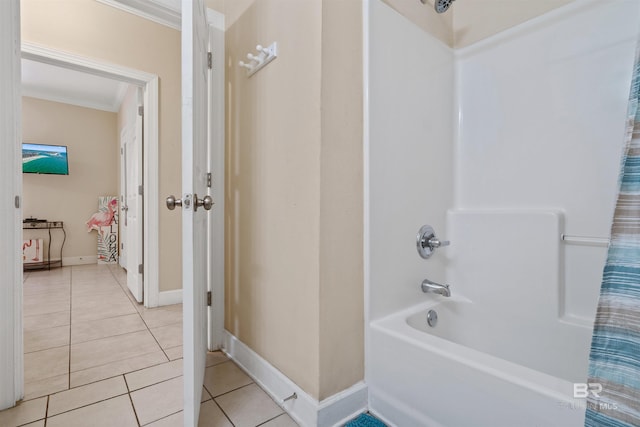 bathroom featuring shower / bath combo with shower curtain, tile patterned flooring, and ornamental molding