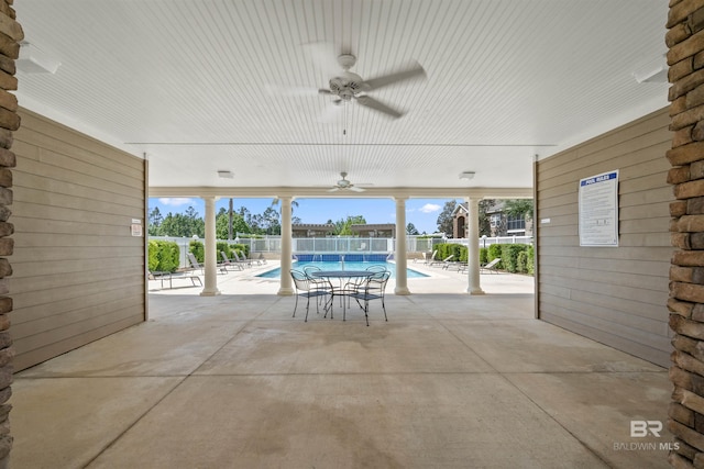 view of patio / terrace featuring ceiling fan and a community pool