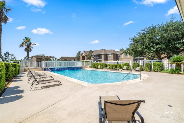 view of swimming pool with a patio area