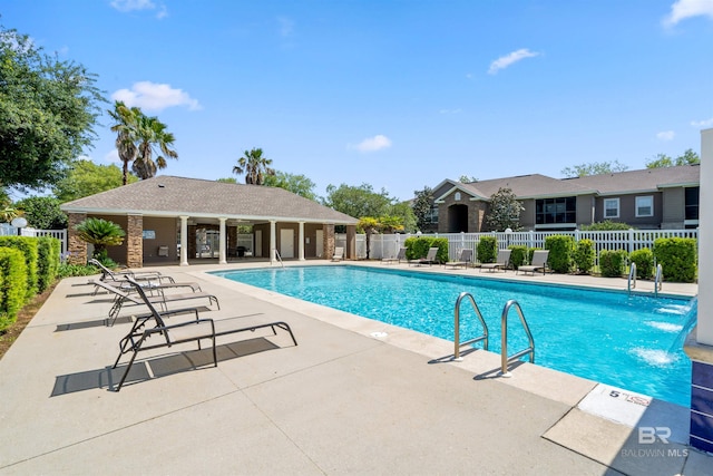 view of pool featuring a patio