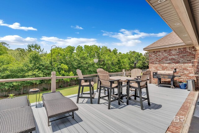 24085 Trowbridge Ct, Daphne, AL 36256 - wooden terrace with outdoor dining space, area for grilling, and a lawn