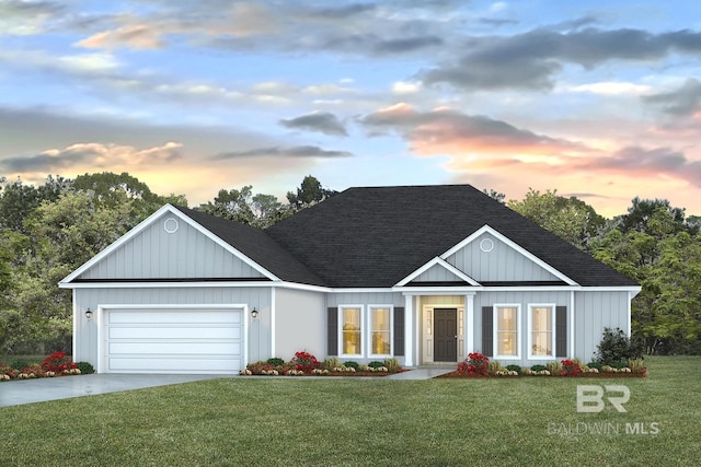 view of front facade with a garage and a lawn