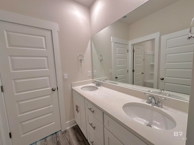 bathroom featuring vanity and wood-type flooring