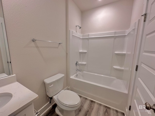 full bathroom with shower / tub combination, wood-type flooring, vanity, and toilet