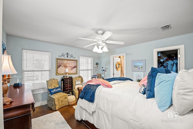 bedroom with visible vents and a ceiling fan