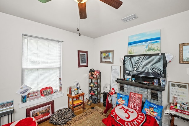 recreation room with visible vents and ceiling fan