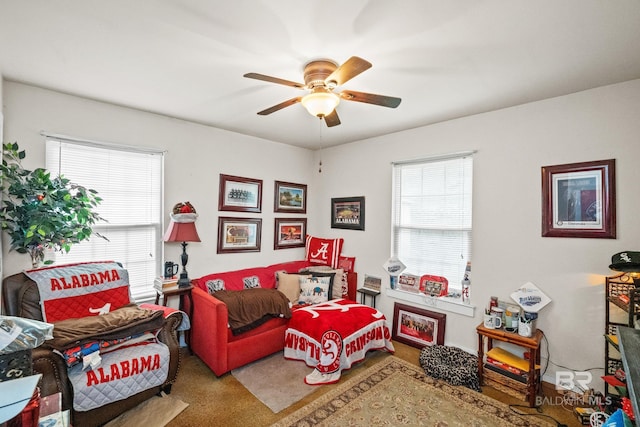 bedroom with multiple windows, a ceiling fan, and carpet floors