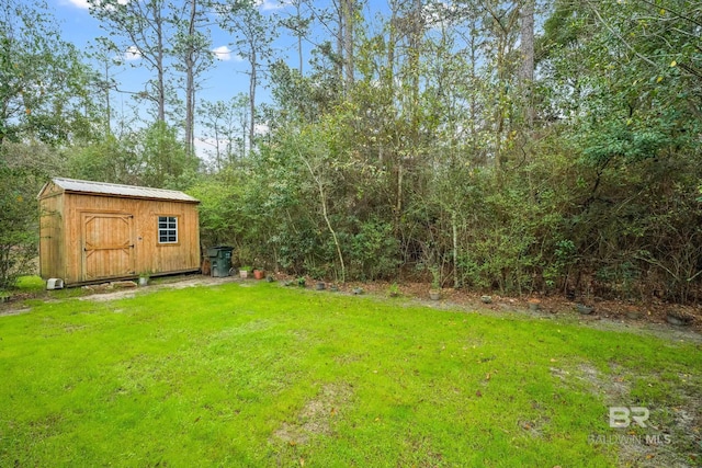 view of yard with an outbuilding and a shed