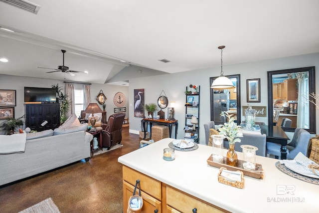 kitchen with light countertops, pendant lighting, visible vents, and ceiling fan