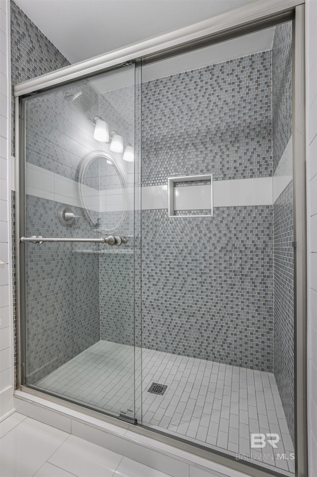 bathroom featuring a shower stall