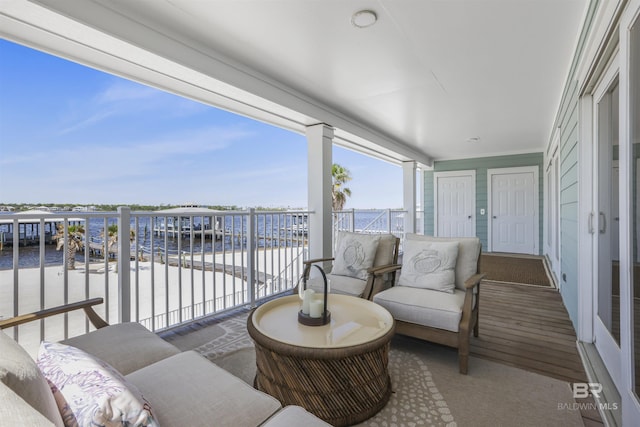 balcony featuring a water view
