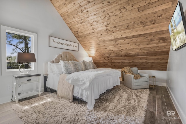 bedroom featuring baseboards, wooden ceiling, wood finished floors, and lofted ceiling