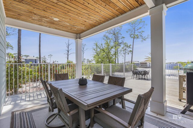 wooden deck with outdoor dining area