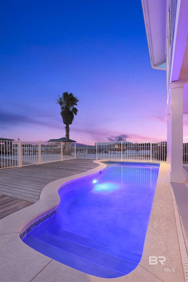 view of pool featuring a fenced in pool, a deck, and fence