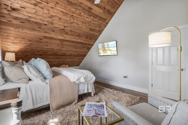 bedroom featuring baseboards, wood finished floors, wooden ceiling, and vaulted ceiling