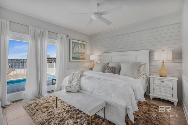 bedroom with tile patterned flooring, access to exterior, and ceiling fan
