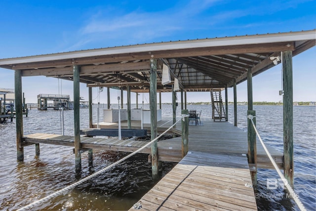 view of dock with a water view and boat lift
