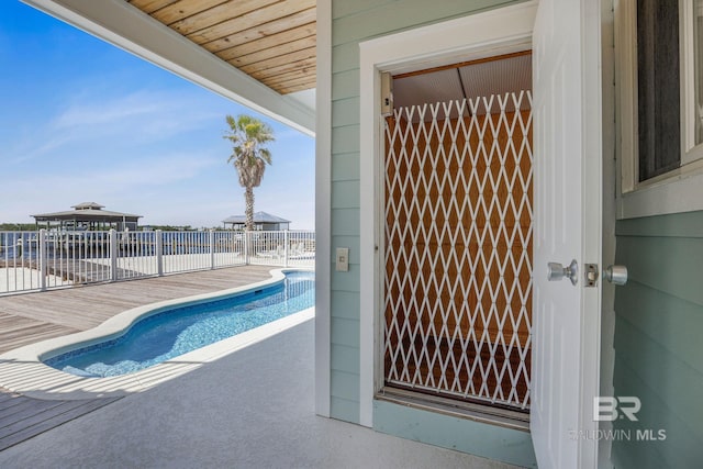 view of swimming pool featuring a fenced in pool