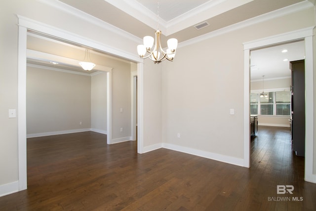 unfurnished room featuring visible vents, dark wood-type flooring, crown molding, baseboards, and a chandelier