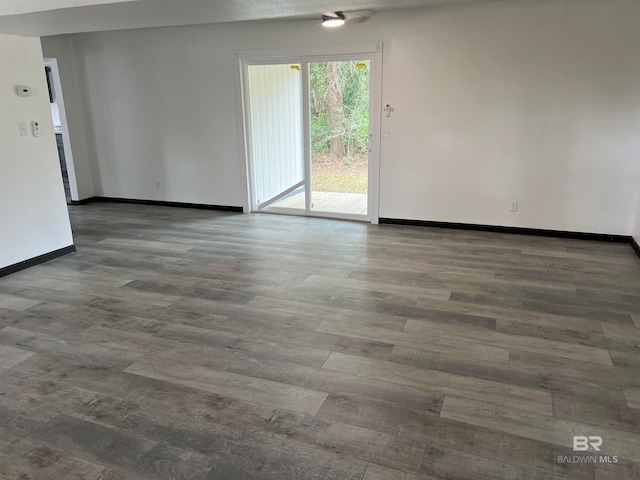 spare room featuring dark hardwood / wood-style floors