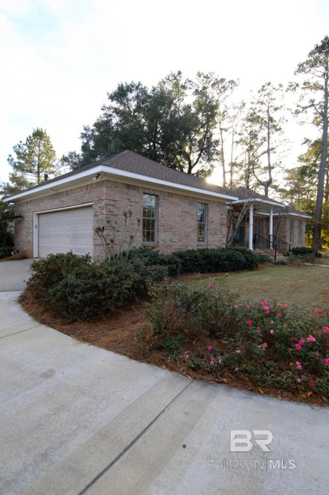 view of side of property featuring a garage