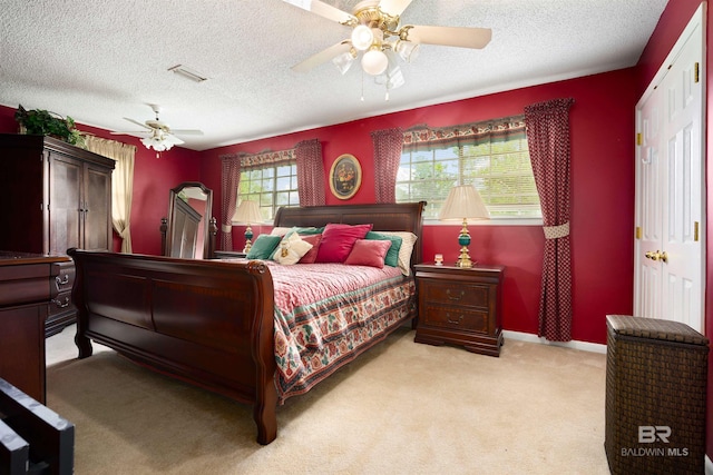 517 Simms Dr, Saraland, AL 36571 - bedroom featuring a textured ceiling, light colored carpet, and ceiling fan