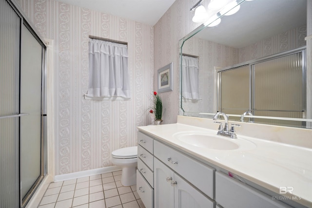 517 Simms Dr, Saraland, AL 36571 - bathroom with tile patterned floors, a shower with door, vanity, and wallpapered walls