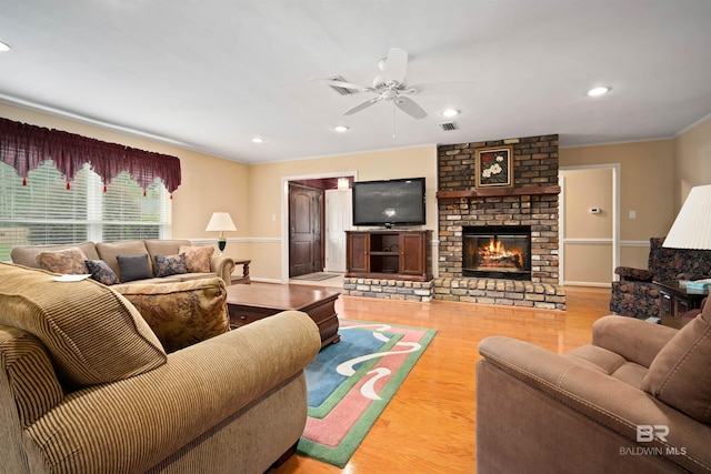 517 Simms Dr, Saraland, AL 36571 - living area featuring wood finished floors, ceiling fan, crown molding, a fireplace, and recessed lighting