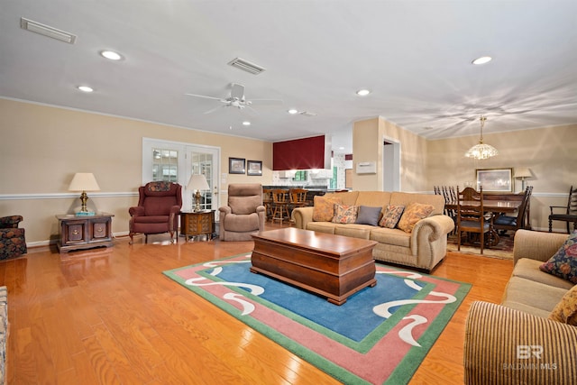 517 Simms Dr, Saraland, AL 36571 - living area featuring recessed lighting, wood finished floors, a chandelier, a ceiling fan, and crown molding