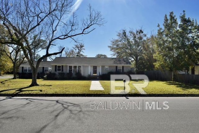 ranch-style home featuring a front yard