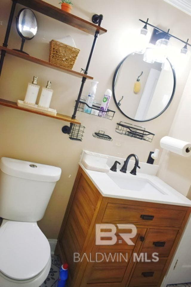 bathroom with vanity and toilet