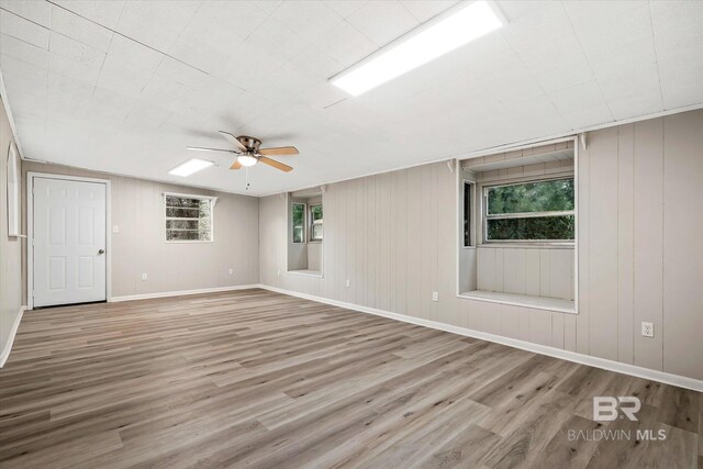 spare room featuring ceiling fan and hardwood / wood-style flooring