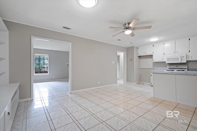 kitchen featuring white cabinets, white appliances, backsplash, and ceiling fan