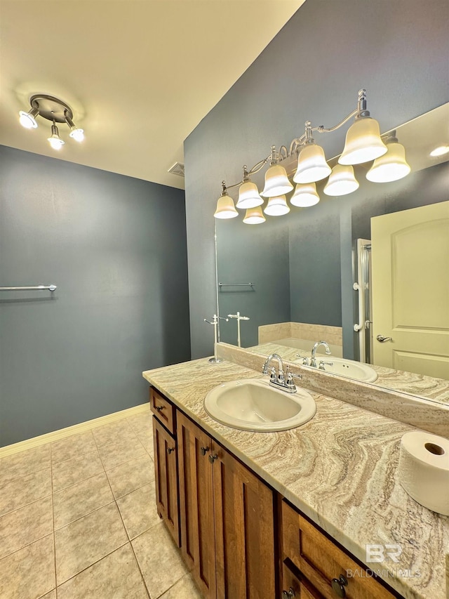 bathroom with tile patterned floors and vanity