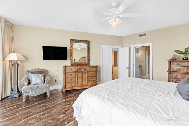 bedroom featuring ceiling fan, dark hardwood / wood-style flooring, and ensuite bathroom