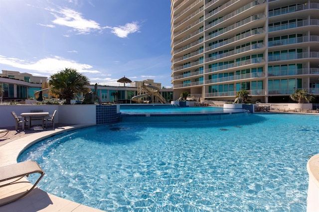 view of pool with pool water feature