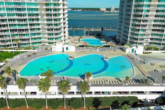 view of pool with a water view