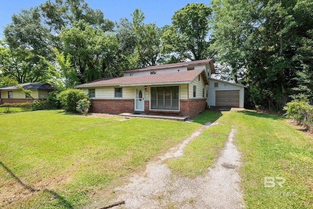 1510 Ponce De Leon Dr, Mobile, AL 36605 - view of front of home with dirt driveway, brick siding, a front lawn, and a garage