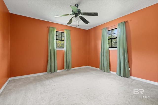 1510 Ponce De Leon Dr, Mobile, AL 36605 - carpeted spare room with healthy amount of natural light, a textured ceiling, baseboards, and a ceiling fan