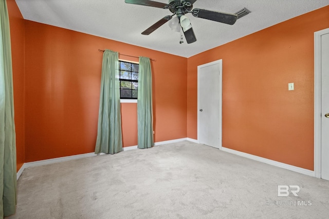 1510 Ponce De Leon Dr, Mobile, AL 36605 - carpeted empty room with ceiling fan, baseboards, and a textured ceiling