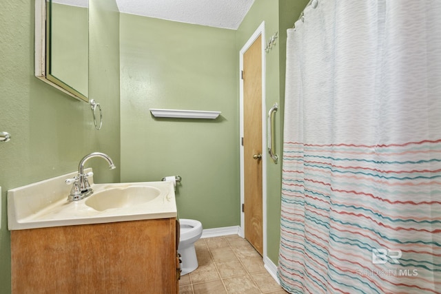 1510 Ponce De Leon Dr, Mobile, AL 36605 - bathroom with toilet, vanity, baseboards, a textured ceiling, and tile patterned floors