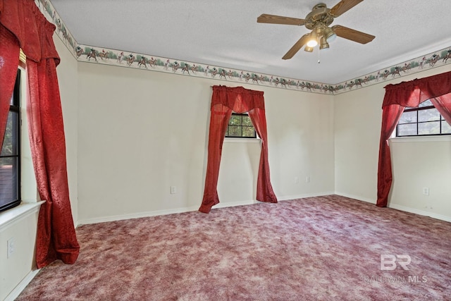 1510 Ponce De Leon Dr, Mobile, AL 36605 - carpeted spare room featuring plenty of natural light, a ceiling fan, a textured ceiling, and baseboards