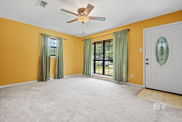 1510 Ponce De Leon Dr, Mobile, AL 36605 - foyer entrance with a textured ceiling, carpet, a ceiling fan, and baseboards